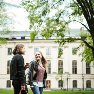two students talking in schoolyard