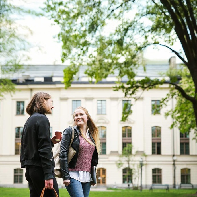 two students talking in schoolyard